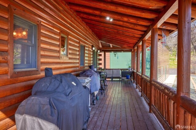 wooden terrace with area for grilling