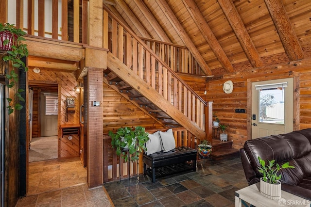 living room with beam ceiling, high vaulted ceiling, and wood ceiling