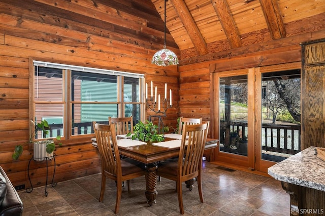 dining space with wood ceiling and vaulted ceiling with beams