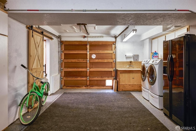 laundry room with independent washer and dryer