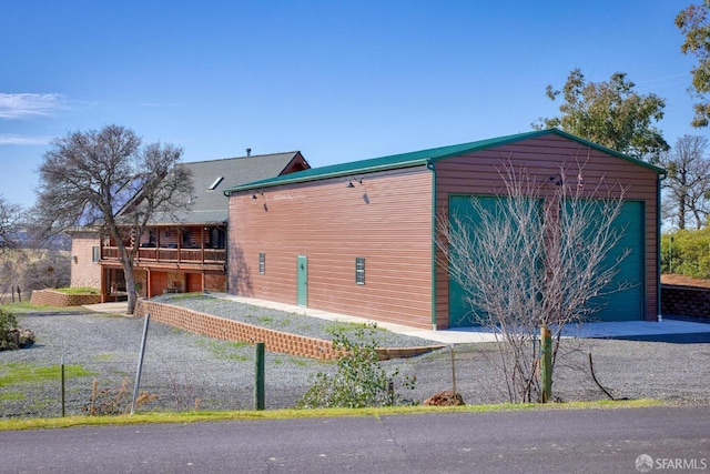 view of side of property featuring a garage