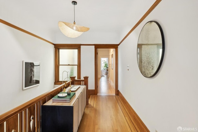 hallway featuring wainscoting and light wood finished floors