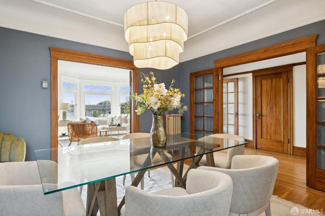 dining space featuring wood finished floors