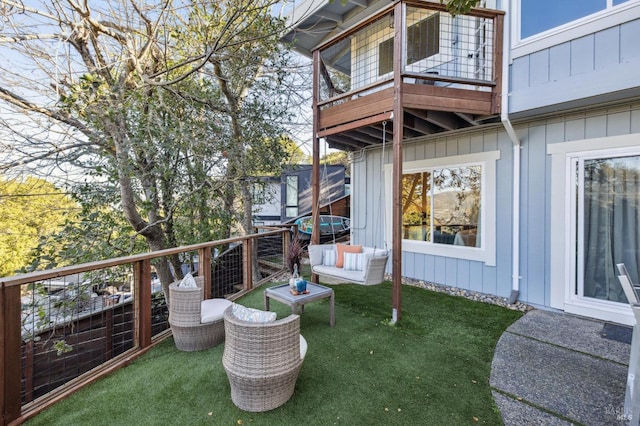 view of patio / terrace featuring a balcony and an outdoor living space