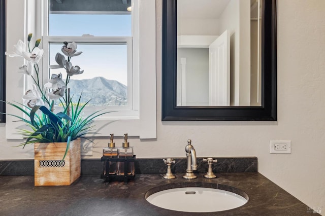 bathroom with vanity and a mountain view