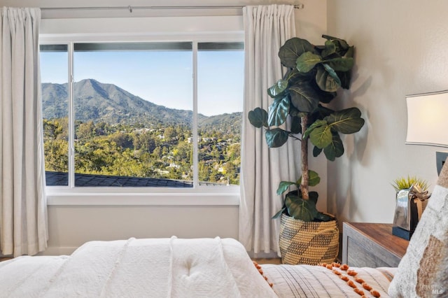 bedroom featuring a mountain view