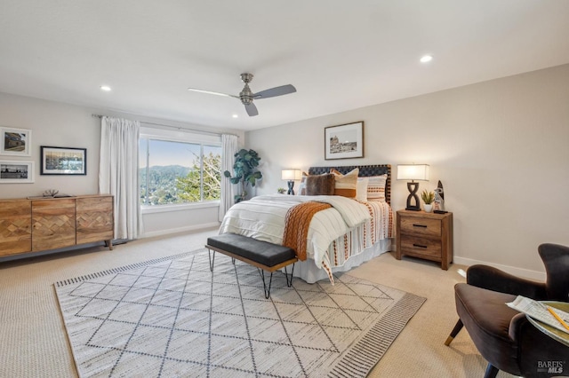 bedroom with light carpet and ceiling fan