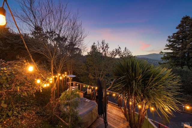 deck at dusk with a mountain view