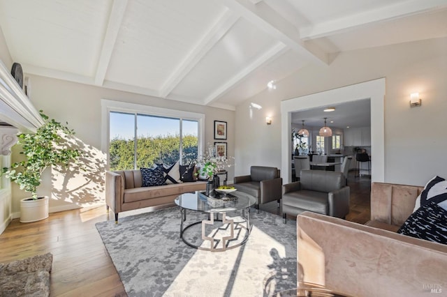 living room with wood-type flooring and lofted ceiling with beams