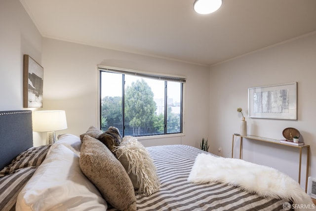bedroom with crown molding