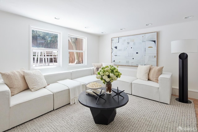 living room with wood finished floors and recessed lighting