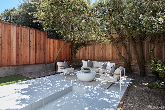 view of patio / terrace featuring an outdoor living space and a fenced backyard