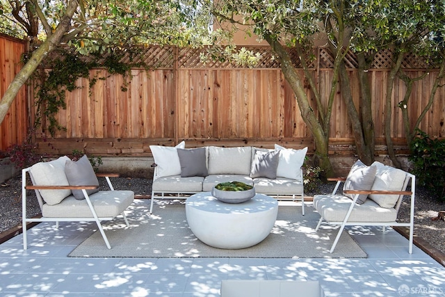 view of patio with an outdoor hangout area and a fenced backyard