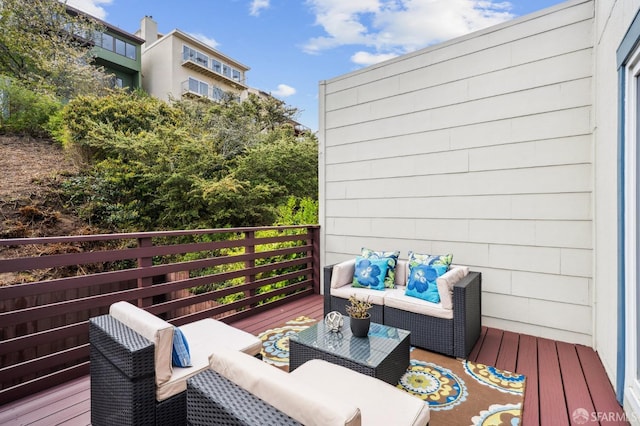 wooden deck featuring outdoor lounge area