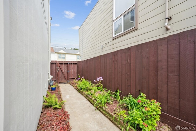 view of property exterior featuring fence