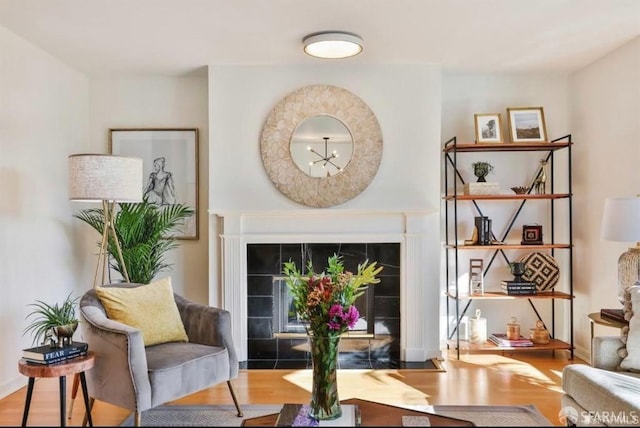 sitting room featuring hardwood / wood-style floors