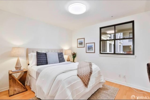 bedroom with light hardwood / wood-style flooring