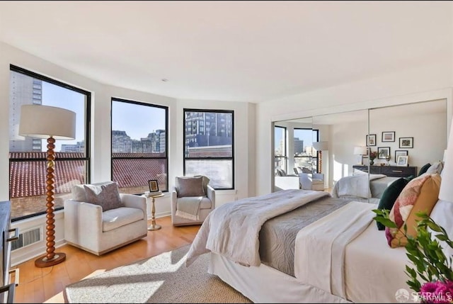 bedroom with hardwood / wood-style flooring