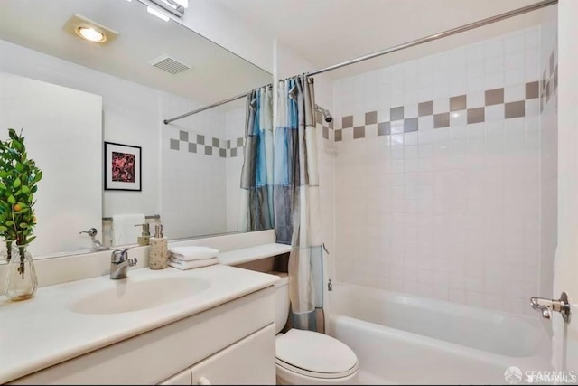 full bathroom featuring vanity, toilet, and shower / bath combo