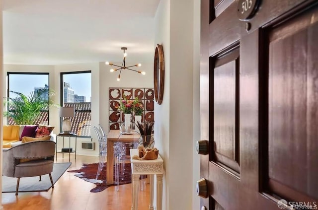 foyer entrance with a chandelier