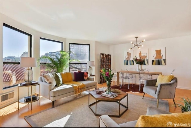 living room featuring a notable chandelier