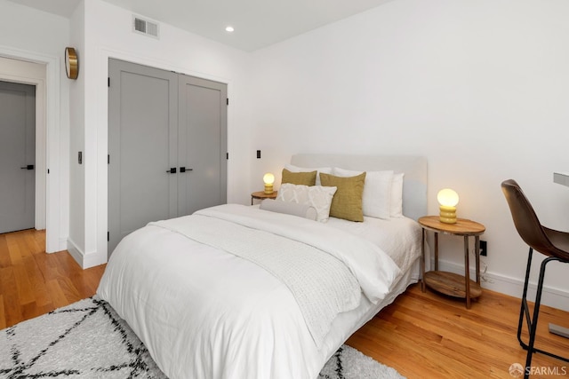 bedroom featuring a closet and light hardwood / wood-style floors