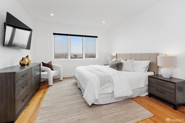 bedroom with light hardwood / wood-style floors