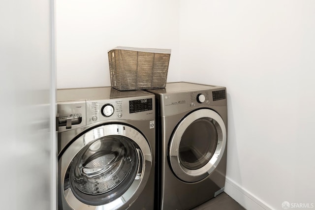 washroom with washing machine and dryer