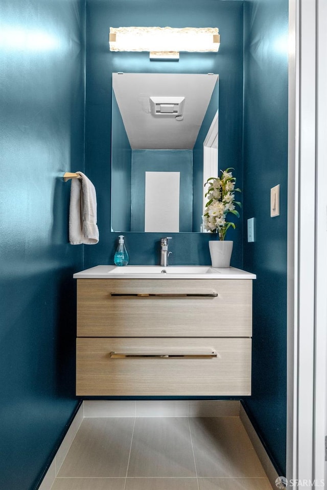 bathroom with tile patterned floors and vanity