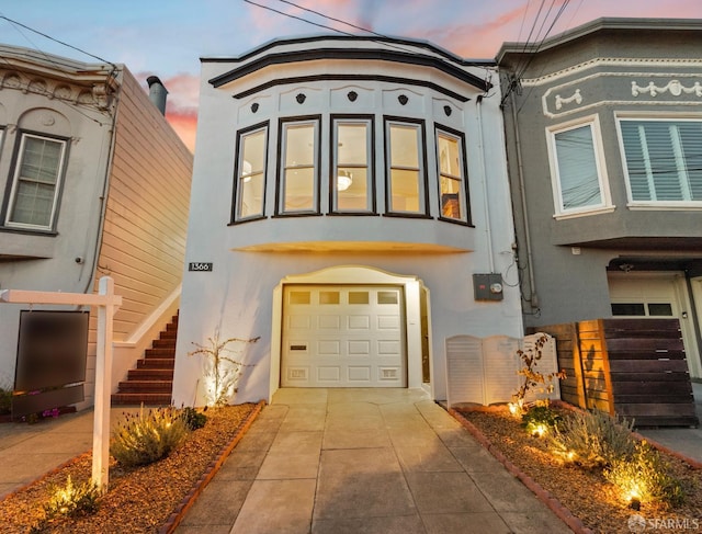 view of front of home featuring stucco siding and an attached garage