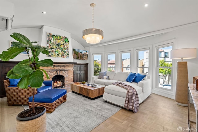 living area featuring a brick fireplace, lofted ceiling, and recessed lighting