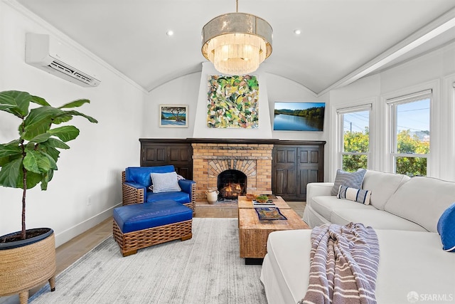 living room featuring an AC wall unit, vaulted ceiling, baseboards, wood finished floors, and a brick fireplace