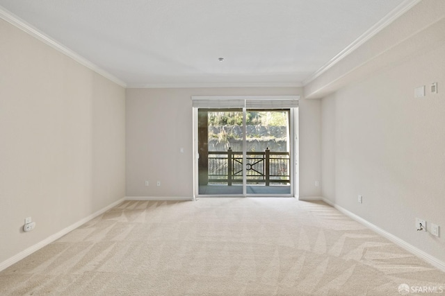 unfurnished room with ornamental molding and light carpet