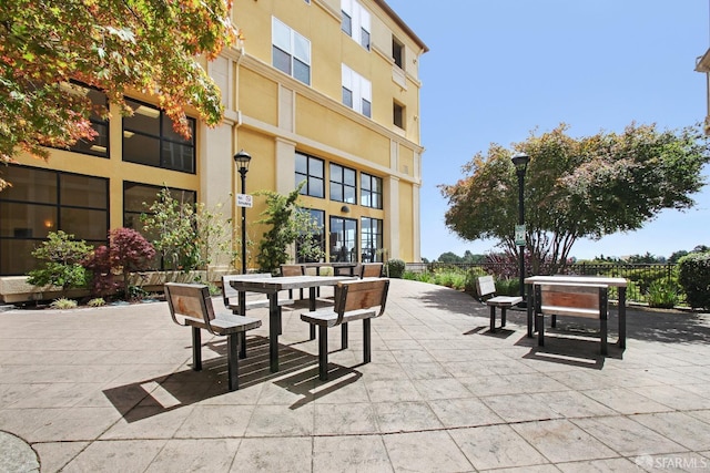 surrounding community featuring a patio area