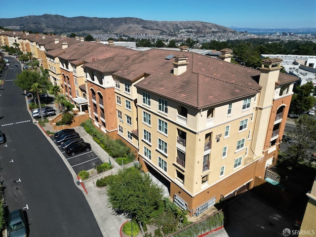 birds eye view of property featuring a mountain view