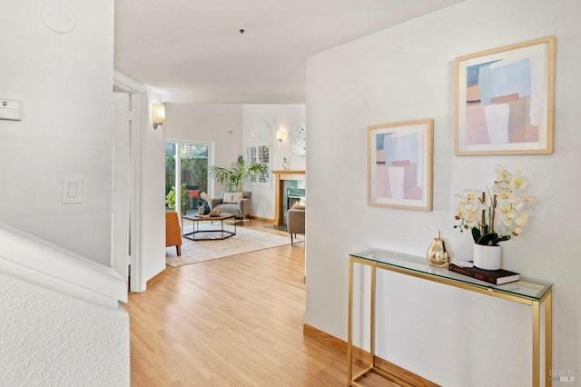 hallway with light wood-style floors