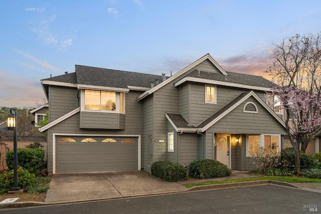 view of front facade with a garage and concrete driveway