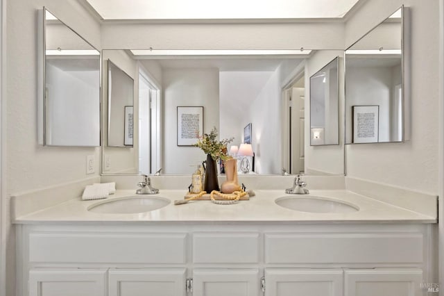 bathroom with double vanity and a sink