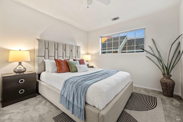 carpeted bedroom with ceiling fan, visible vents, and baseboards