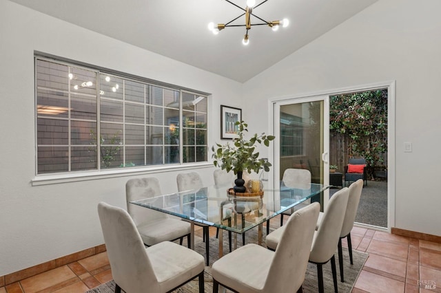 tiled dining area with vaulted ceiling, baseboards, and an inviting chandelier