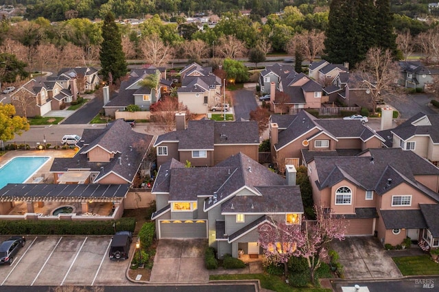 birds eye view of property with a residential view