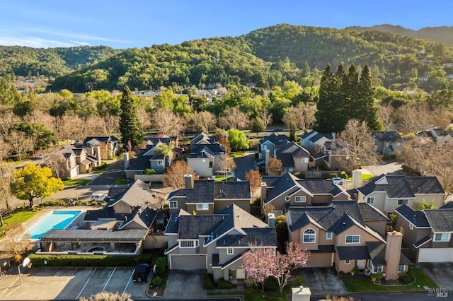 birds eye view of property with a residential view