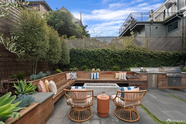 view of patio / terrace with a deck and area for grilling