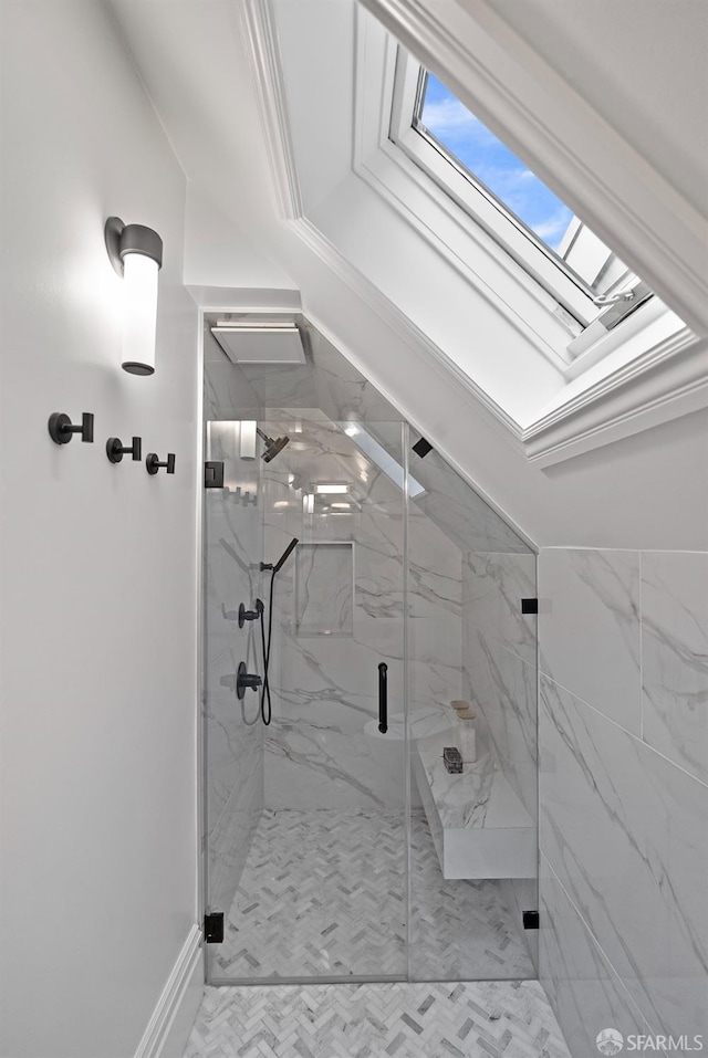 bathroom featuring walk in shower and a skylight