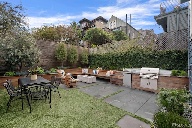 view of patio / terrace featuring area for grilling and exterior kitchen