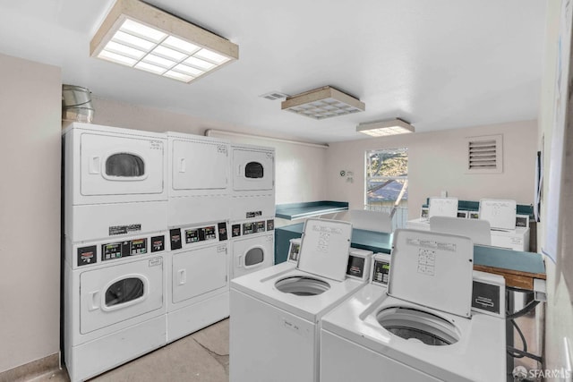 laundry room featuring independent washer and dryer and stacked washing maching and dryer