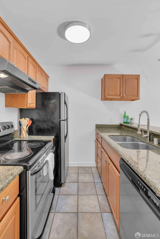 kitchen with sink, light tile patterned floors, appliances with stainless steel finishes, light stone countertops, and exhaust hood