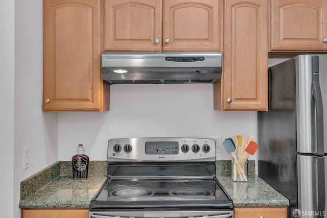 kitchen with stainless steel appliances, exhaust hood, and dark stone counters