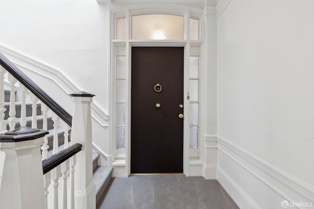 entrance foyer with carpet floors