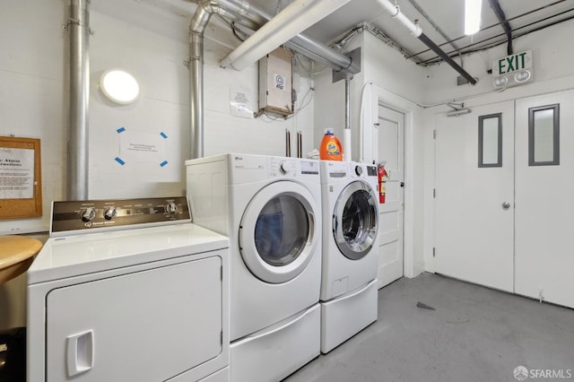 washroom with separate washer and dryer